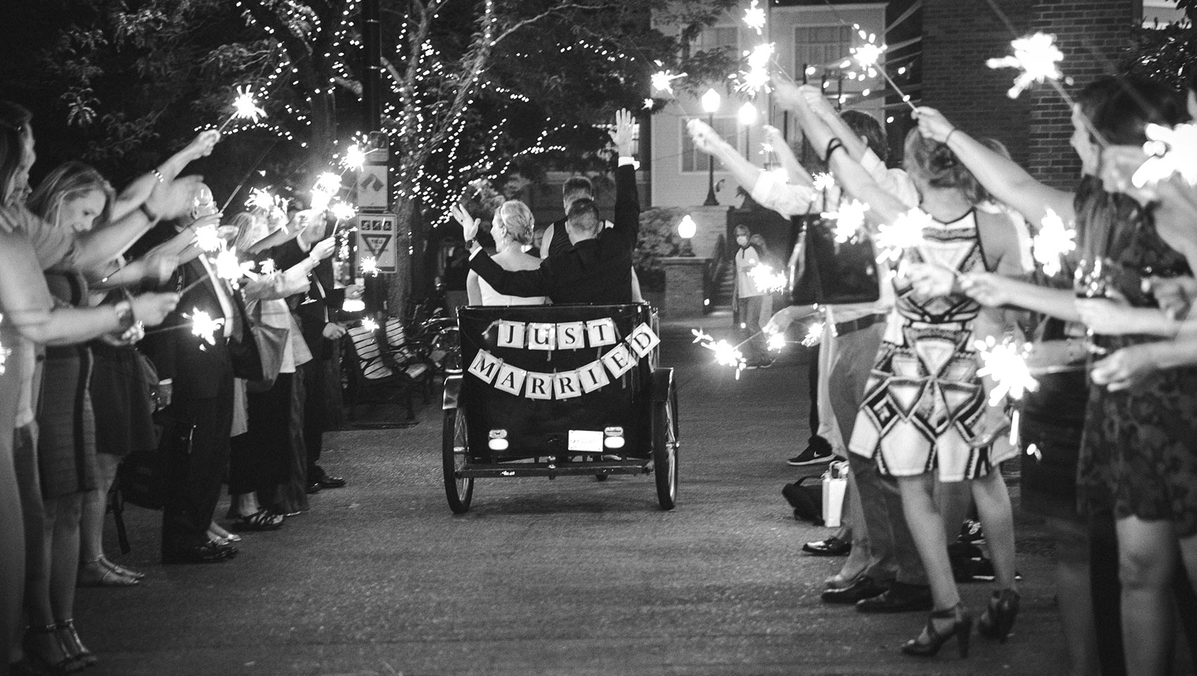 bride and groom riding in pedicab at wedding ceremony at outdoor Portland wedding venue