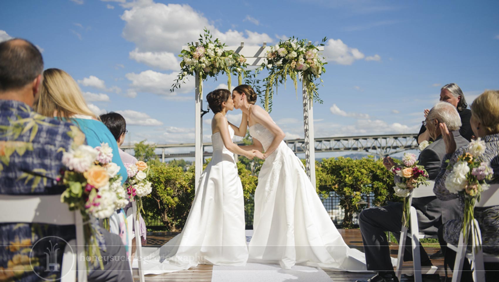 bride kisses bride at LGBT wedding ceremony