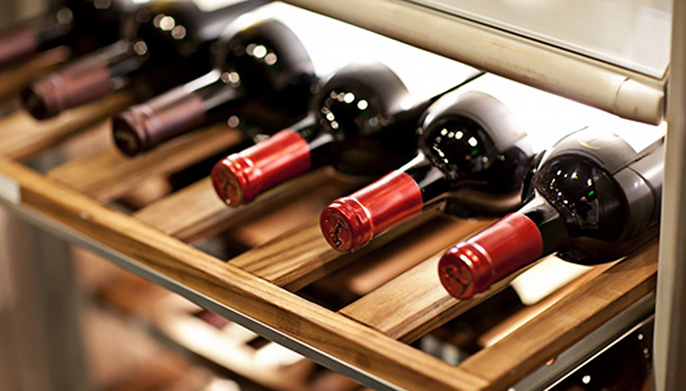 wine rack with bottles of red wine