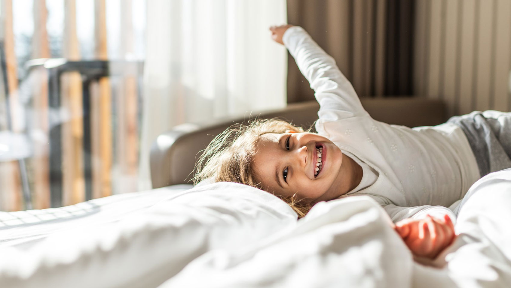 girl lying on bed