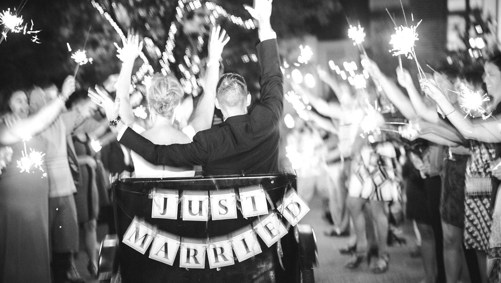 bride and groom riding in a pedicab at wedding ceremony at outdoor Portland wedding venue