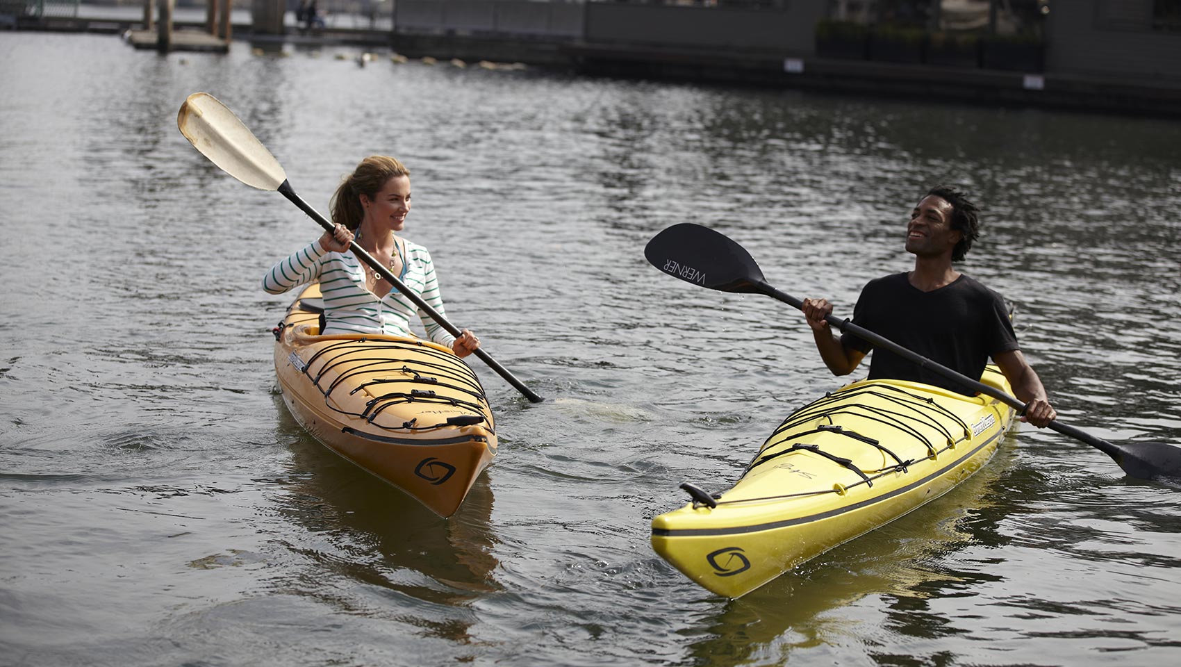 two people kayaking in river