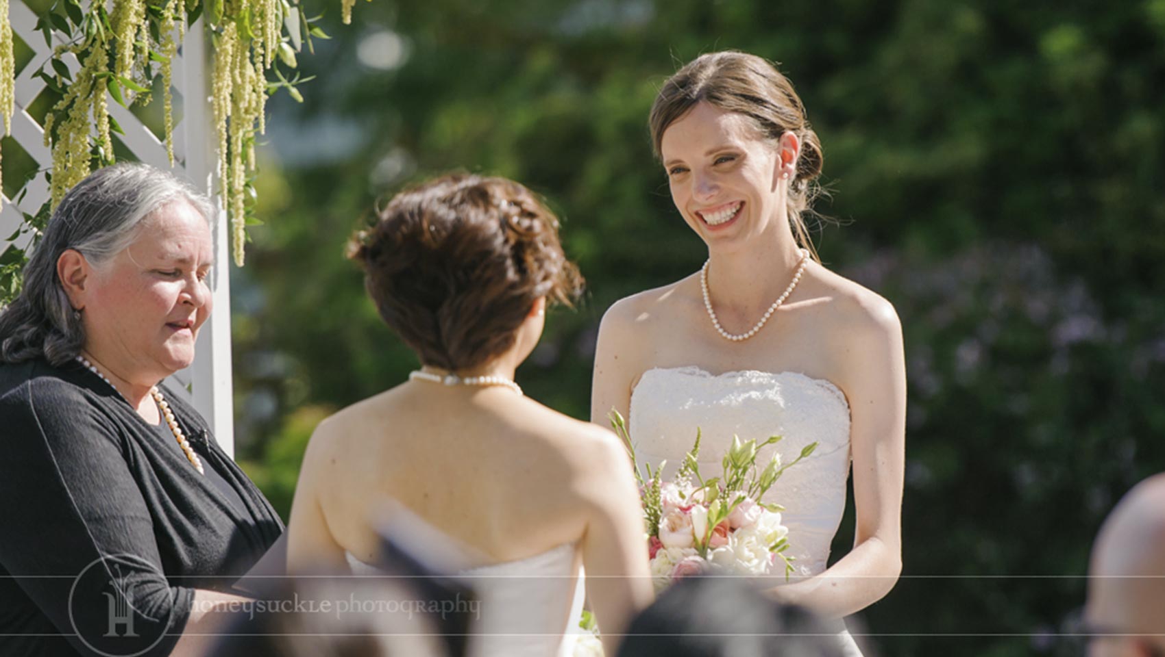 close up of smiling bride at LGBT wedding
