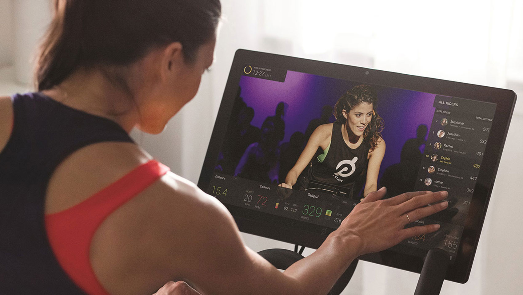 Woman on Peloton Bike