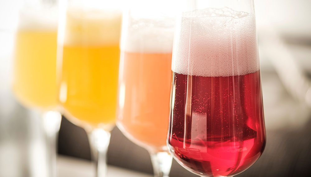 colorful glasses of mimosas
